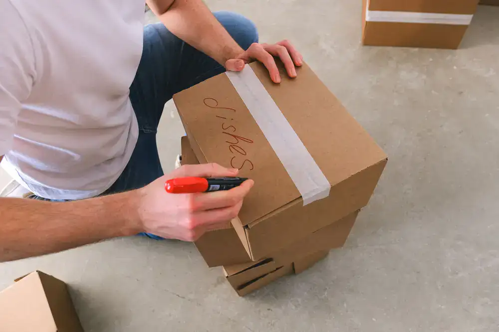 Stack of fresh moving boxes and protective wrapping