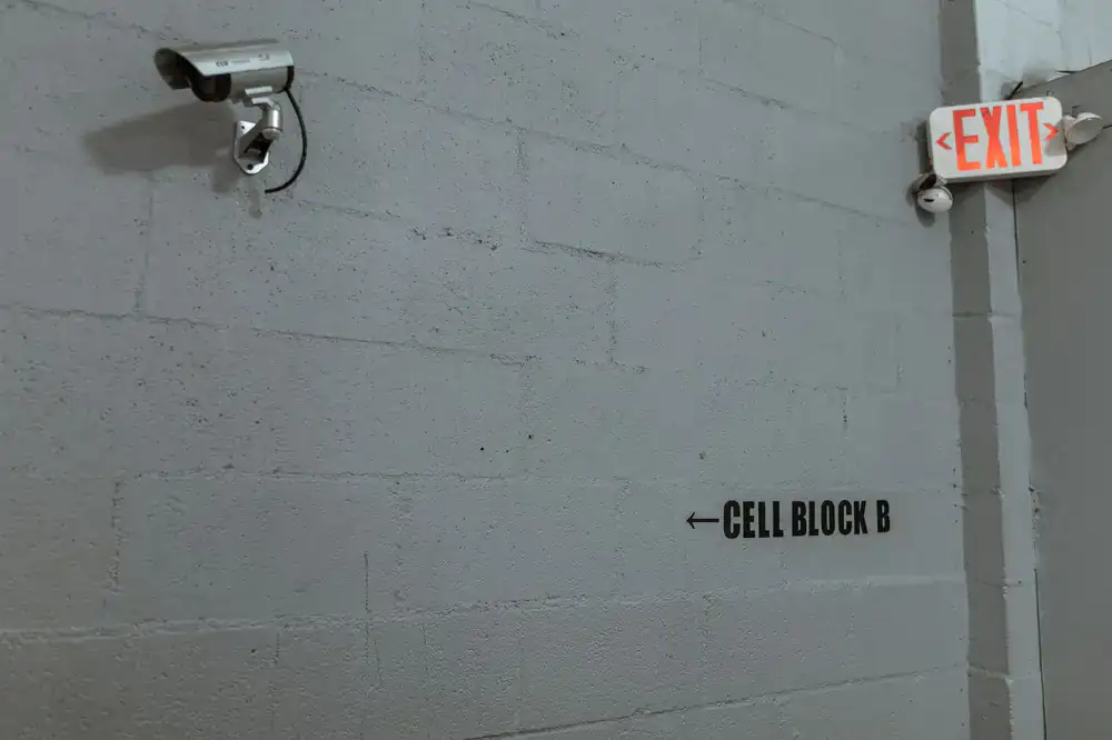 Modern security camera mounted on a pristine facility wall